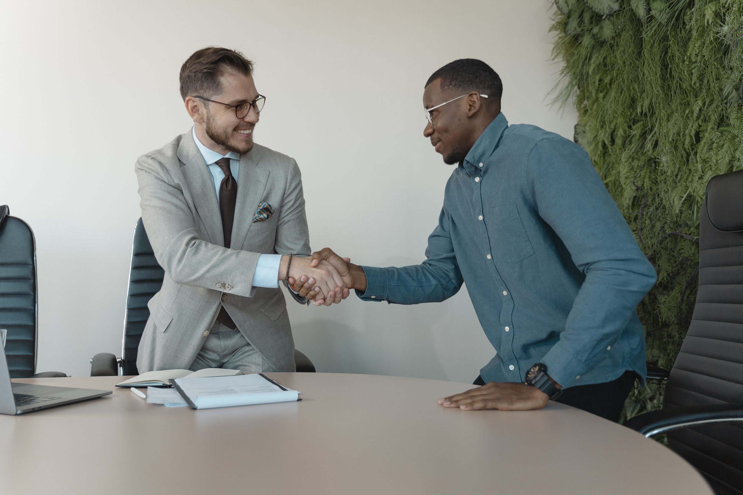 Real estate agent shaking hands after their interview with sponsoring brokerage